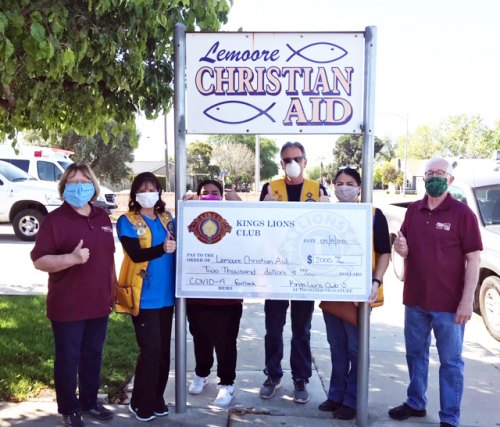 LCA volunteers Karen Christensen (left) and Nick Francu (far right) accept $2000 check from Kings Lions Gina Arcino (president), Ray Etchegoin, and Maggie Ochoa.